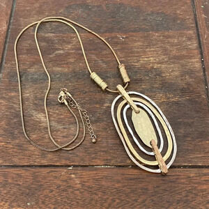 Statement gold and silver tone pendant necklace